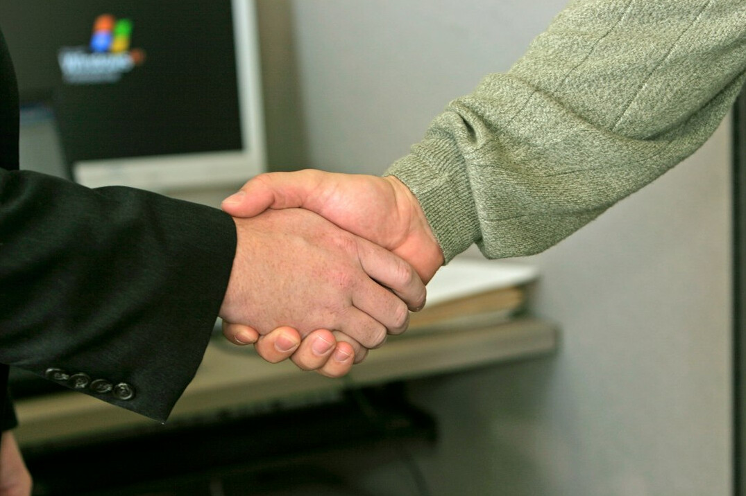two people shaking hands