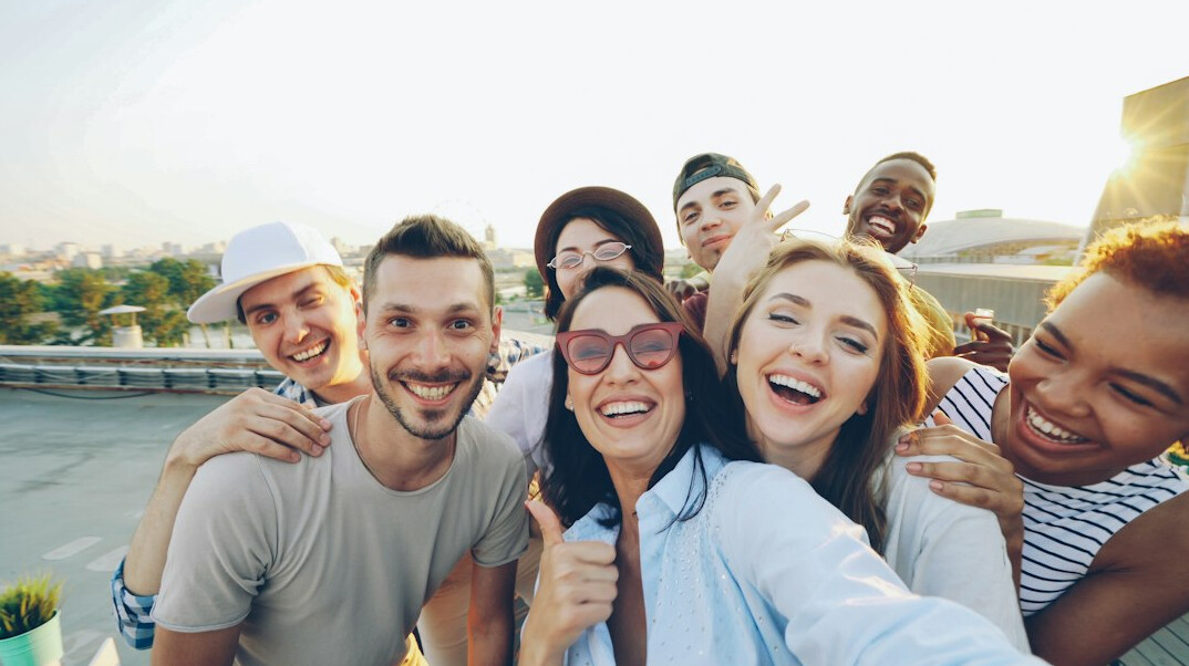 group of celebrities smiling
