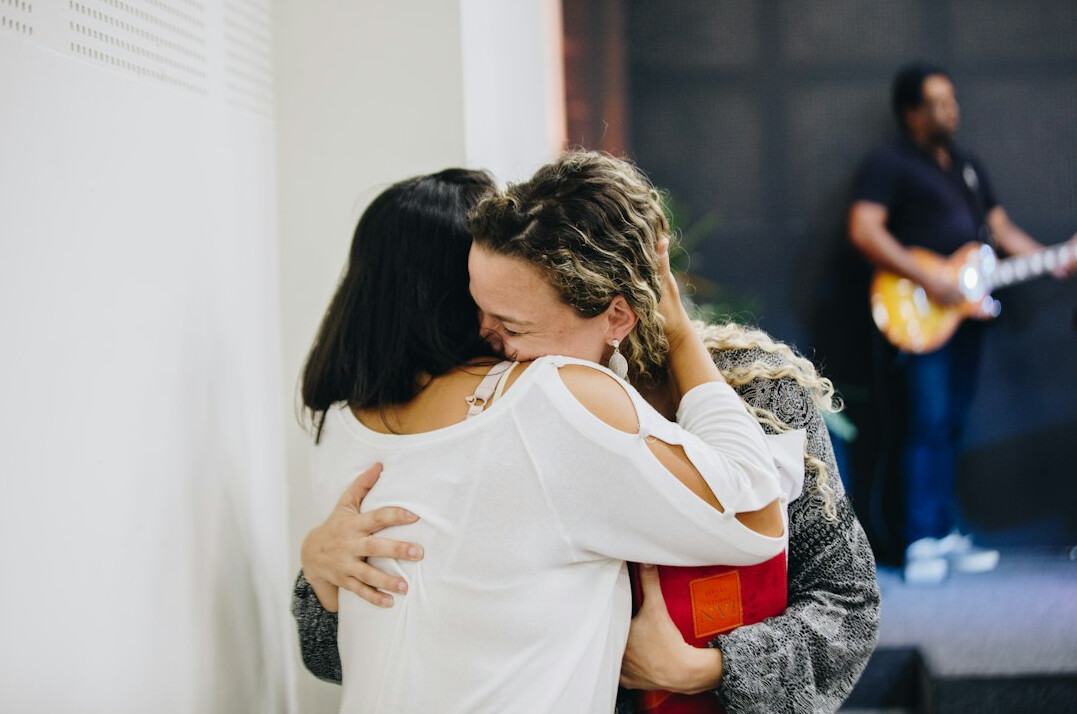 woman embracing friend